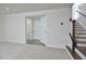 Inviting foyer with a staircase, closet and convenient half bathroom at 1020 Kentlands Dr, Durham, NC 27713