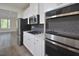 Modern kitchen features stainless steel appliances, gas cooktop, and a view into the home at 1020 Kentlands Dr, Durham, NC 27713