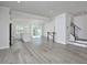 Spacious living room showcases open concept to kitchen, hardwood floors, and bright, neutral colors at 1020 Kentlands Dr, Durham, NC 27713