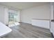 Living room features hardwood floors, white walls, and a sliding glass door at 1020 Kentlands Dr, Durham, NC 27713