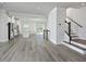 Open living space features hardwood floors, kitchen and a staircase at 1020 Kentlands Dr, Durham, NC 27713