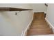Wood stairs with handrail and white risers lead to the next level at 1020 Kentlands Dr, Durham, NC 27713