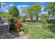 Landscaped backyard with a small bird bath and an assortment of colorful flowers and plants at 103 Temple Gate Dr, Cary, NC 27518