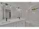 Bright bathroom with a double sink vanity, black fixtures, and a large mirror at 103 Temple Gate Dr, Cary, NC 27518