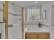 Bathroom with glass-enclosed shower, tub, and window offering natural light at 103 Temple Gate Dr, Cary, NC 27518