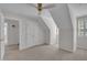 A room featuring carpeted floors, a ceiling fan, and an ensuite bath at 103 Temple Gate Dr, Cary, NC 27518