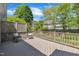 Outdoor deck with chairs and a small table overlooking a landscaped backyard at 103 Temple Gate Dr, Cary, NC 27518