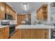 Well-equipped kitchen with stainless steel appliances, ample cabinet space, and a breakfast bar at 103 Temple Gate Dr, Cary, NC 27518
