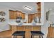 Modern kitchen featuring stainless steel appliances, breakfast bar and wood cabinetry at 103 Temple Gate Dr, Cary, NC 27518