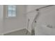 Laundry room with tiled floors, a utility sink, and lots of natural light at 103 Temple Gate Dr, Cary, NC 27518