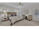 Serene main bedroom with neutral tones, featuring a ceiling fan and plantation shutters at 103 Temple Gate Dr, Cary, NC 27518