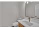 Stylish half-bathroom featuring a modern vanity and minimalist fixtures at 103 Temple Gate Dr, Cary, NC 27518