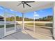 Back porch features a fan and view of yard at 105 Blooms Way, Kenly, NC 27542