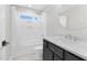 Bathroom featuring tub and shower, granite counters, dark vanity and tiled floor at 105 Blooms Way, Kenly, NC 27542