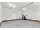 Spacious garage with painted walls, brick base, and a water filtration system at 105 Blooms Way, Kenly, NC 27542