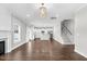 Spacious living area with hardwood floors, fireplace, and an open floor plan leading to the kitchen at 105 Blooms Way, Kenly, NC 27542