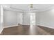 Spacious bedroom features hardwood floors, ceiling fan, and easy access to both bathroom and walk-in closet at 105 Blooms Way, Kenly, NC 27542