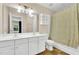 Bathroom features a double vanity, a toilet, and a shower/tub with a patterned curtain at 105 Ryder Cup Cir, Raleigh, NC 27603