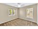 Cozy bedroom with plush carpeting, a ceiling fan, and multiple windows providing natural light at 105 Ryder Cup Cir, Raleigh, NC 27603
