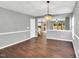 Dining room with hardwood floors that opens to other rooms in the house at 105 Ryder Cup Cir, Raleigh, NC 27603