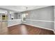 Open dining area with hardwood floors and an elegant pendant chandelier at 105 Ryder Cup Cir, Raleigh, NC 27603