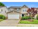Inviting two-story home with a two car garage and beautifully landscaped front yard at 105 Ryder Cup Cir, Raleigh, NC 27603