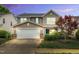 Inviting two-story home with a two car garage and beautifully landscaped front yard at 105 Ryder Cup Cir, Raleigh, NC 27603