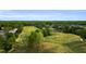 Scenic aerial shot of the golf course with mature trees and well-maintained fairways at 105 Ryder Cup Cir, Raleigh, NC 27603