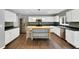 Spacious kitchen with stainless steel appliances and a large center island at 105 Ryder Cup Cir, Raleigh, NC 27603