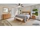 The main bedroom boasts a comfortable bed, matching nightstands, and calming decor with bright windows at 105 Ryder Cup Cir, Raleigh, NC 27603