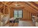 Unfinished attic offers potential for customization and extra storage space at 1100 Queensbury Cir, Durham, NC 27713