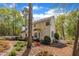 View of the backyard featuring lush landscaping, a wooden deck, and a charming white picket fence at 1100 Queensbury Cir, Durham, NC 27713