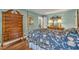 Bedroom with wooden furniture, floral bedspread, and hardwood floors at 1100 Queensbury Cir, Durham, NC 27713