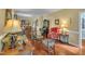 Spacious living room with a blend of elegant furnishings, hardwood floors, and abundant natural light at 1100 Queensbury Cir, Durham, NC 27713