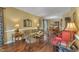 Inviting living room featuring hardwood floors, traditional decor, and ample natural light at 1100 Queensbury Cir, Durham, NC 27713