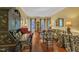 Comfortable living room with hardwood floors, bright light, and classic furnishings at 1100 Queensbury Cir, Durham, NC 27713