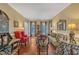 Spacious living room with hardwood floors, comfortable seating, and ample natural light at 1100 Queensbury Cir, Durham, NC 27713