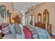 Comfortable bedroom with hardwood floors, walk through to bathroom, and classic furnishings at 1100 Queensbury Cir, Durham, NC 27713