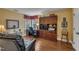 Home office features hardwood floors, natural lighting, and wooden cabinets at 1100 Queensbury Cir, Durham, NC 27713
