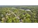 An aerial view of a residential neighborhood with mature trees at 117 Vicksburg Dr, Cary, NC 27513