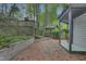 Backyard featuring a brick patio, raised garden beds, a gazebo, and a pergola, creating a serene outdoor space at 117 Vicksburg Dr, Cary, NC 27513