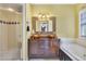 Bathroom boasts double sinks, glass enclosed shower, and relaxing soaking tub at 117 Vicksburg Dr, Cary, NC 27513