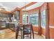 Dining space featuring a table with chairs, a modern light fixture, and a large window at 117 Vicksburg Dr, Cary, NC 27513