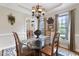 Bright dining area with a glass-top table, neutral walls, and ample natural light at 117 Vicksburg Dr, Cary, NC 27513