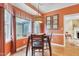 Cozy dining area featuring a modern light fixture, breakfast nook, and rich, warm tones at 117 Vicksburg Dr, Cary, NC 27513