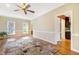 Bright living room with hardwood floors, a patterned area rug, and neutral wall colors at 117 Vicksburg Dr, Cary, NC 27513