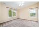Comfortable bedroom with two bright windows and neutral carpet at 1208 Lexington Farm Rd, Apex, NC 27502
