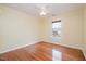 Bedroom with hardwood floors, ceiling fan and a sun-filled window at 1208 Lexington Farm Rd, Apex, NC 27502