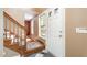Welcoming foyer with hardwood stairs, a tiled floor, and a bright, airy atmosphere at 1208 Lexington Farm Rd, Apex, NC 27502
