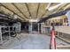 Unfinished basement with exposed insulation, utilities, and a workbench, offering potential for customization and storage at 124 Mantle Dr, Clayton, NC 27527